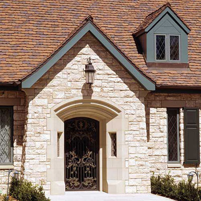 Front Entry with custom gilded wrought iron door