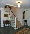 Stanford White inspired Entry Hall with painted paneling by Felhandler Steeneken Architects