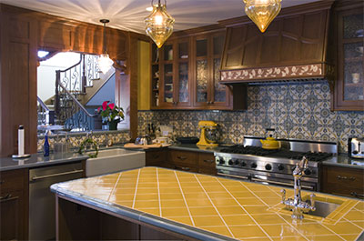 Kitchen with custom marquetry range hood