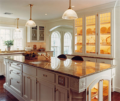 Kitchen has custom cabinets with Georgian details