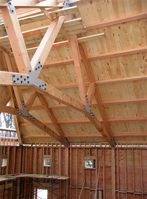 Ceiling is underside of SIPS panel with pine plank finish